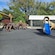 A playground at Wellington Zoo featuring 2 structures shaped like a large tarantula and a lizard with a slide coming out of its gaping mouth